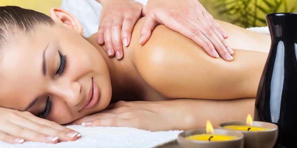 Beautiful woman getting a massage in the spa salon